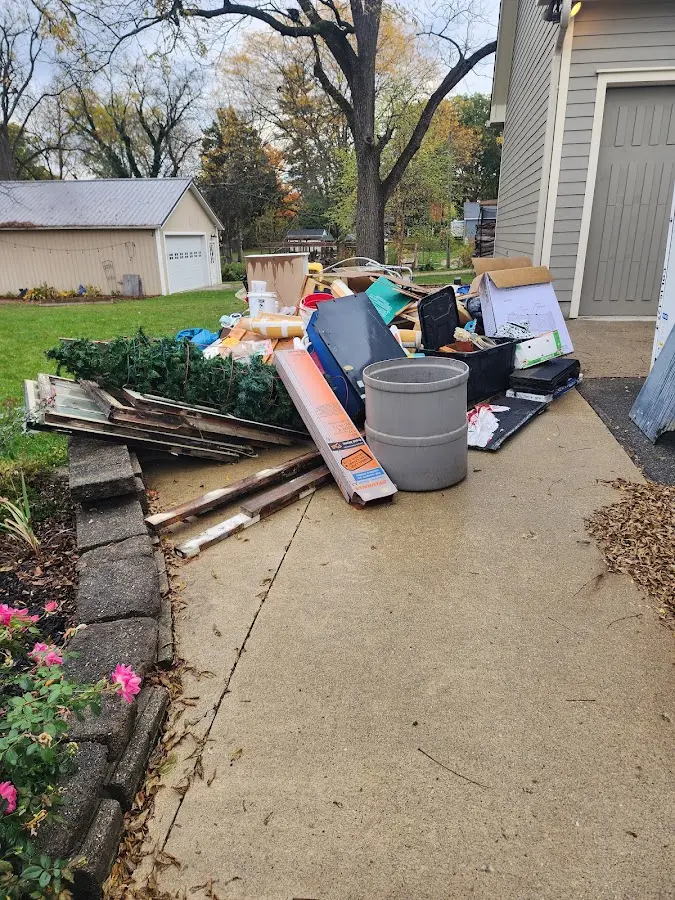 Dumpster being loaded with debris for 3 Yard Dumpster Rental in Racine